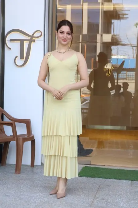 Tamannaah Bhatia was spotted looking fresh and gorgeous in a lemon yellow dress at her jewellery store in the city. Tamannaah Bhatia was spotted looking fresh and gorgeous in a lemon yellow dress at her jewellery store in the city.